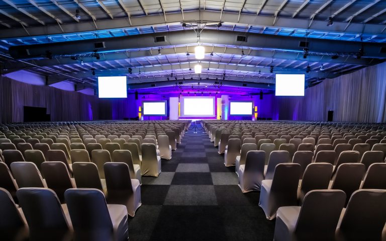 Rows of empty chairs in the large conference hall for corporate convention or lecture